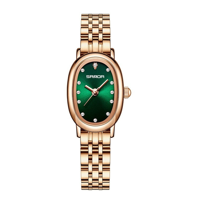 Gold watch with a green face on a white background