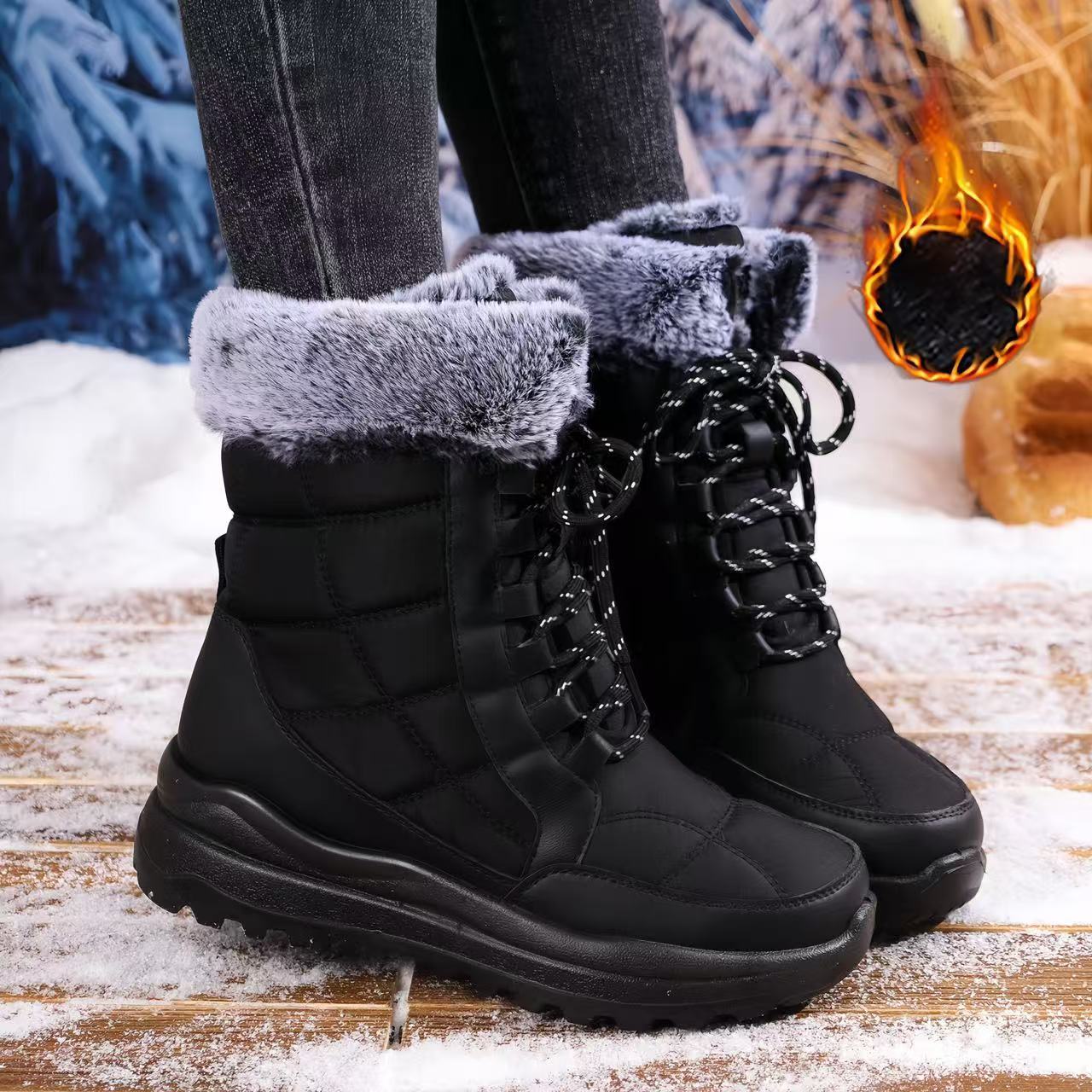 Black winter boots with gray fur lining worn by a person on a snowy ground.
