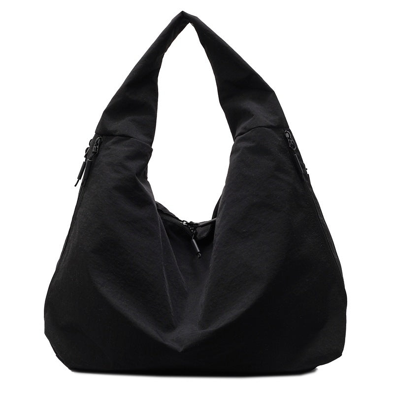 Black shoulder bag on a white background
