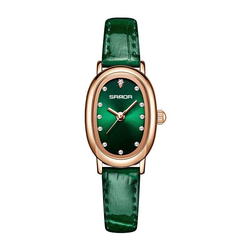 Green watch with rose gold case and green strap on white background