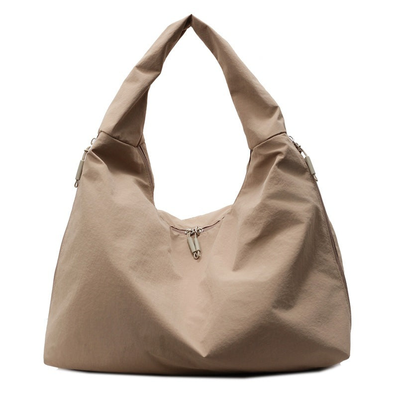 Beige handbag on a white background