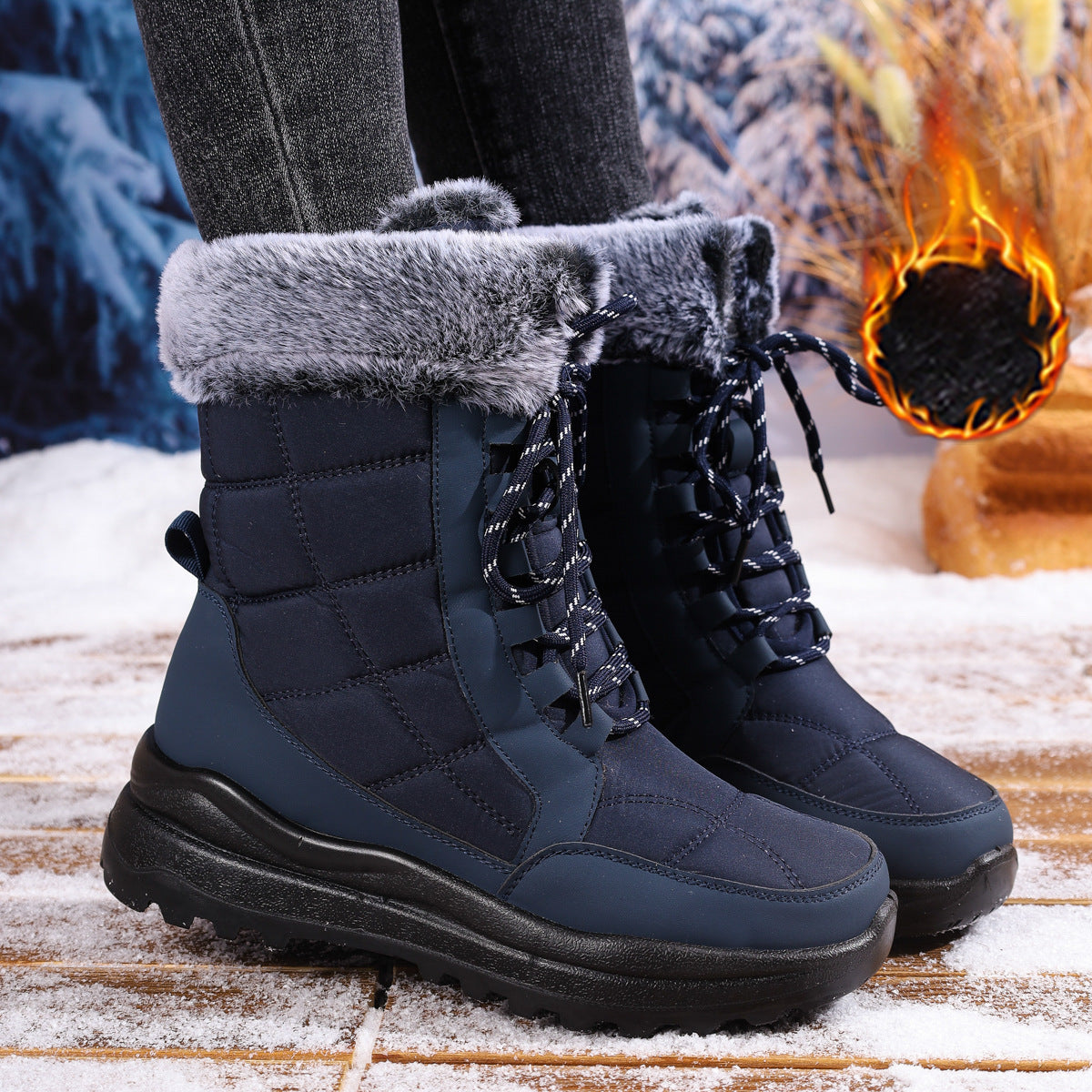 Blue winter boots with gray fur lining worn by a person, with a warm fire in the background.