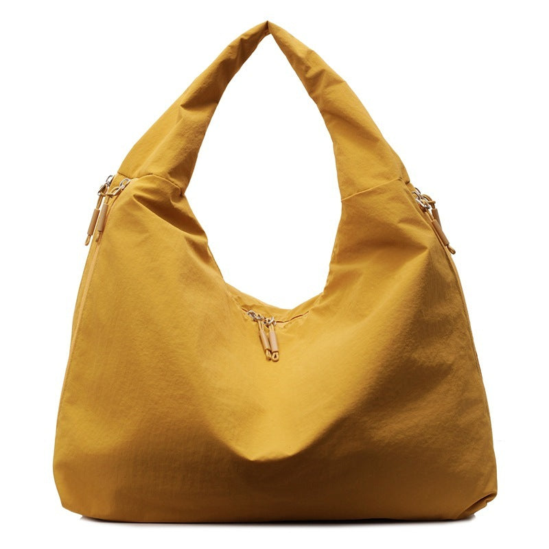 Yellow handbag on a white background