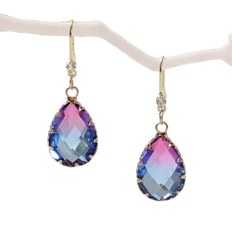 Multicolored teardrop earrings on a white background
